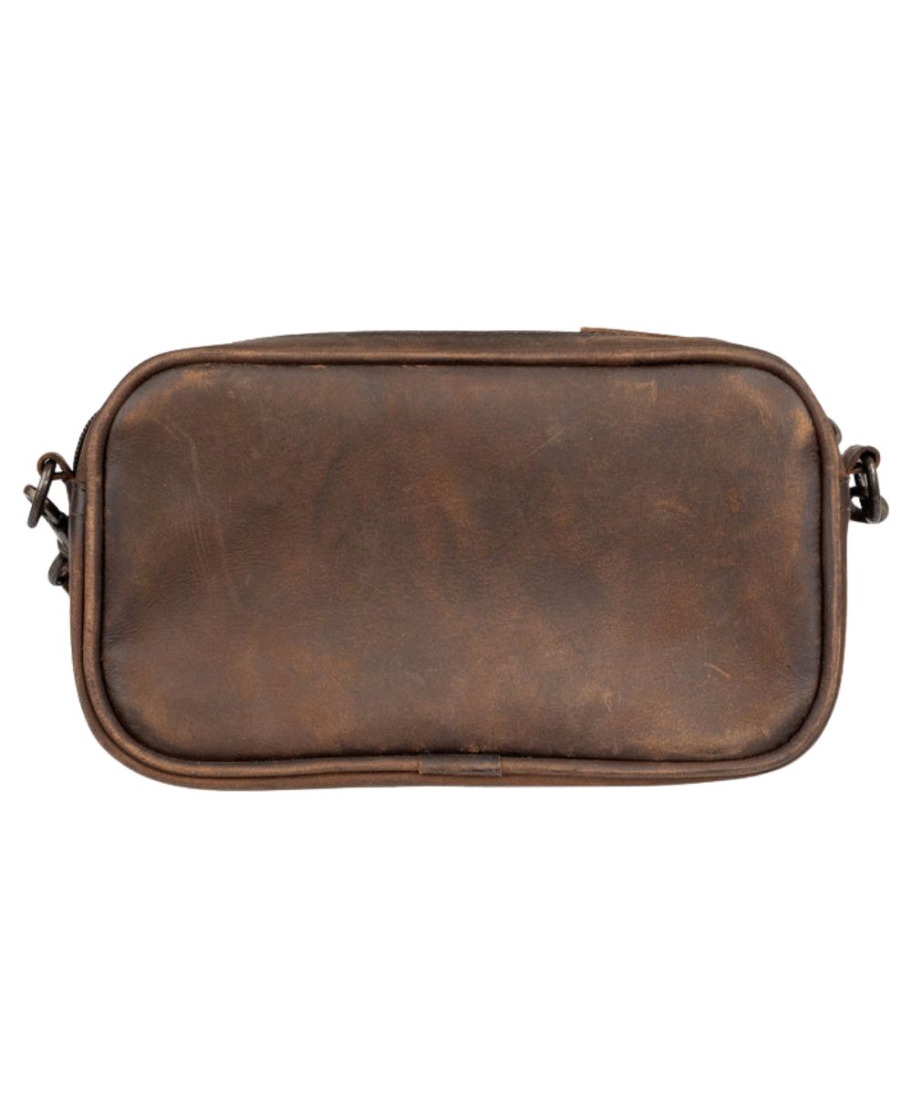 Back view of the women's crossbody featuring the dark brown solid leather back