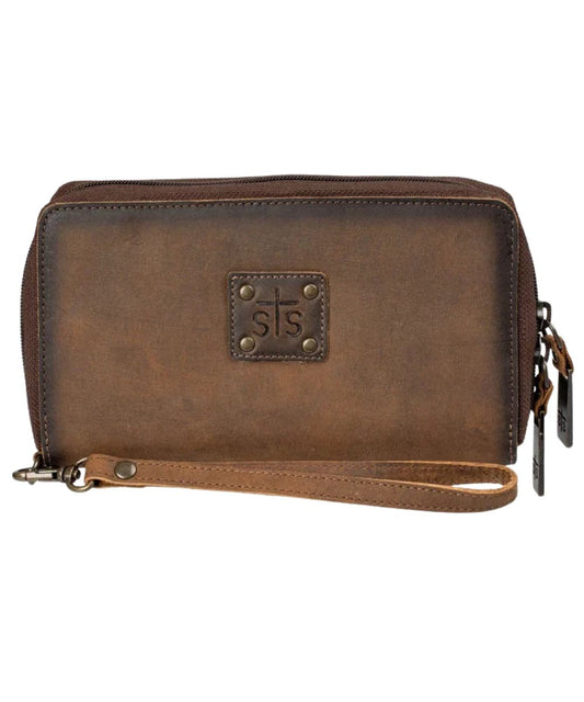 Front view of the women's brown STS Baroness Kacy Organizer featuring the STS branded leather patch with metal studs, zip-around closure, and a removable leather wristlet strap