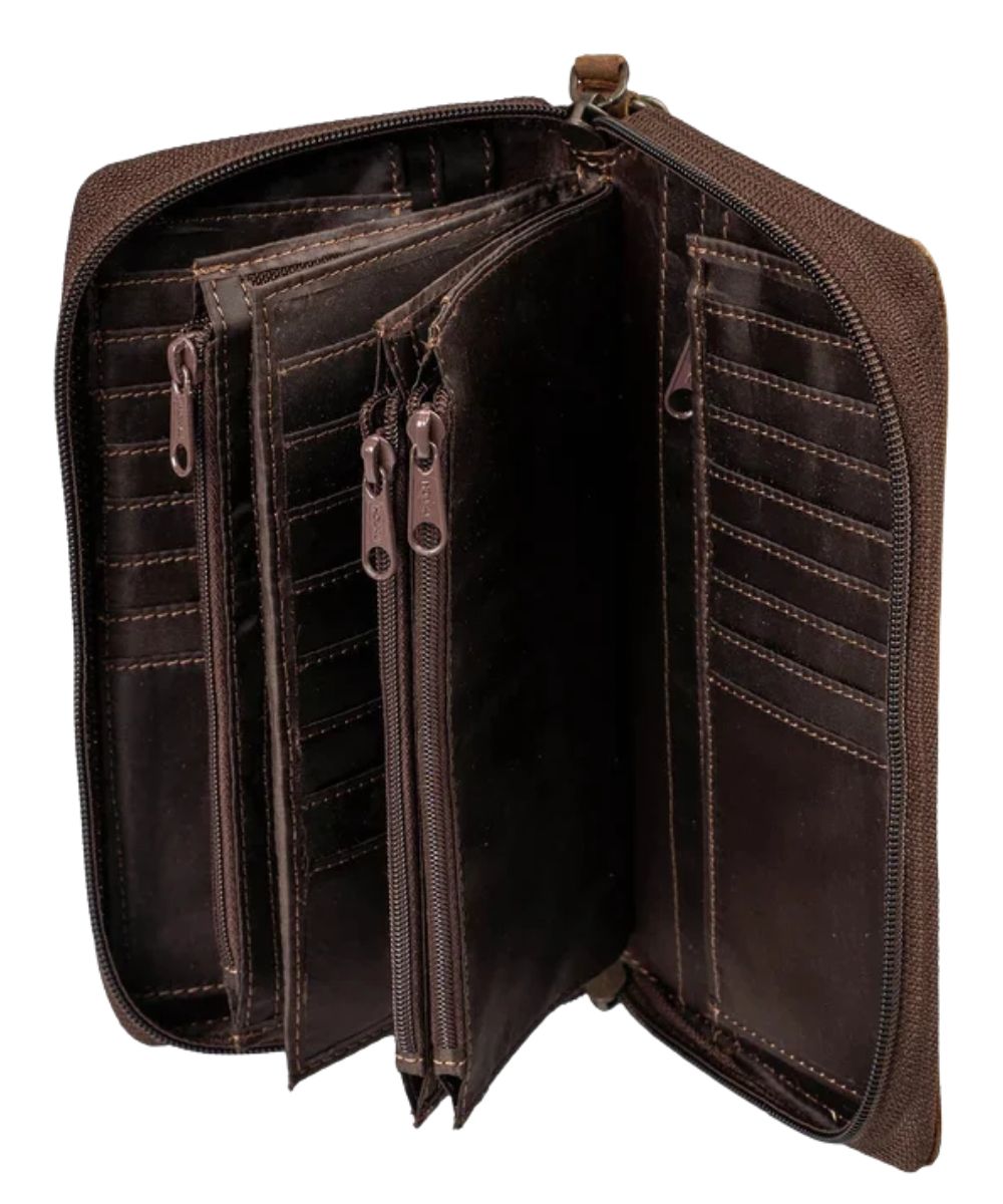 Interior view of the women's brown leather organizer wallet featuring the many card slots, interior zip pockets, and slip pockets
