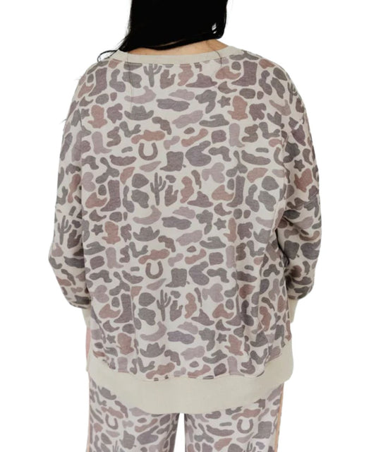 Back view of the women's western camo printed long sleeve sweatshirt featuring the neutral incorporated western motifs of cacti, horseshoes, and steer horns in taupe, gray, and beige