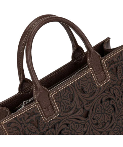 dark brown satchel purse with floral tooled design and intricate cutouts and matching handles