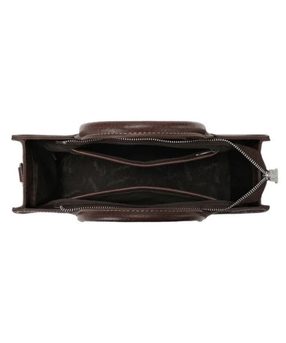 top down view of the interior of a dark brown satchel purse with floral tooled design and intricate cutouts