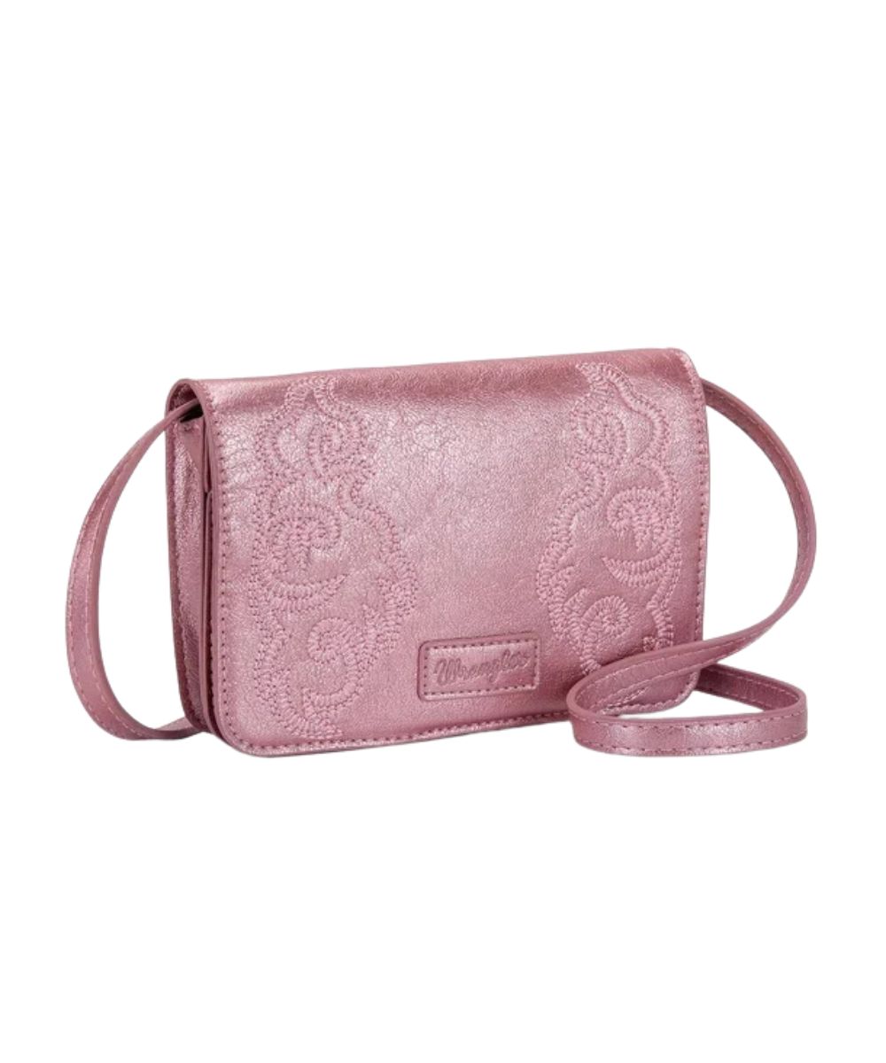 Front view of the women's metallic pink Wrangler Crossbody Bag featuring the western embroidered design and Wrangler logo patch on the front