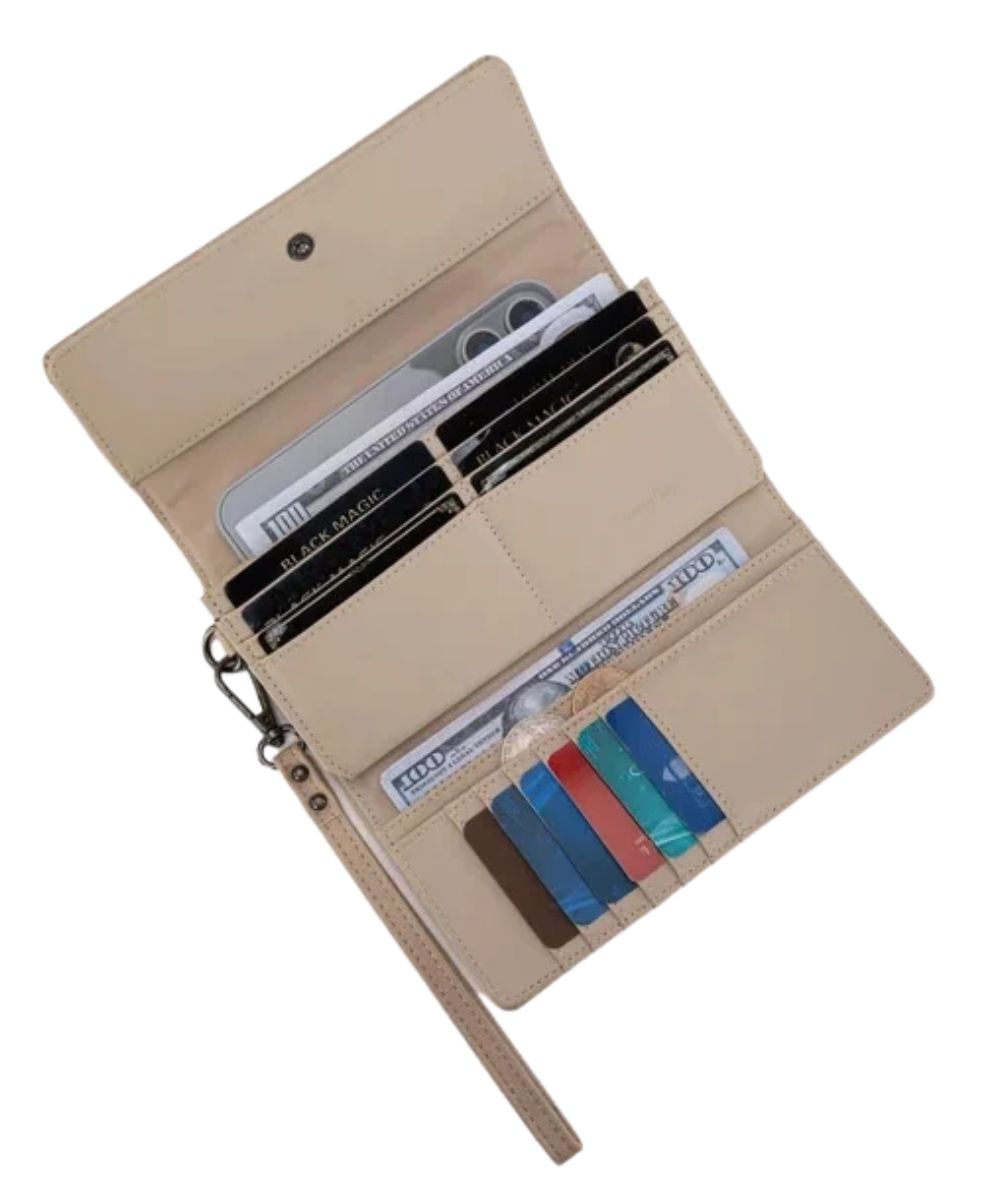Interior view of the women's tan faux leather trifold wallet featuring the 4 open compartments, a zipper pocket, and 13 card slots, and the button closure