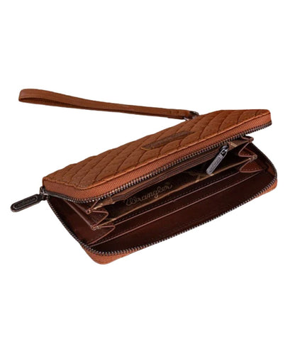 inside open compartments of a brown quilted wallet