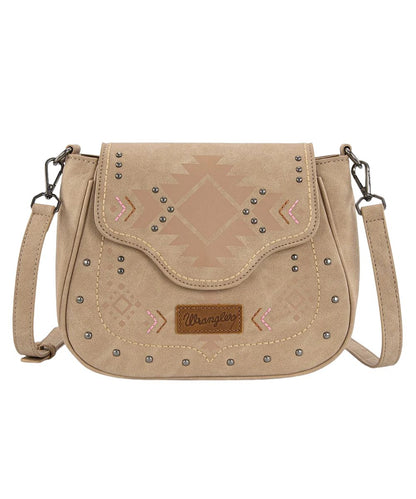 Front view of the women's tan Wrangler faux leather purse featuring the aztec geometric print with silver stud and pink accent details, logo patch, and a removable/adjustable crossbody strap