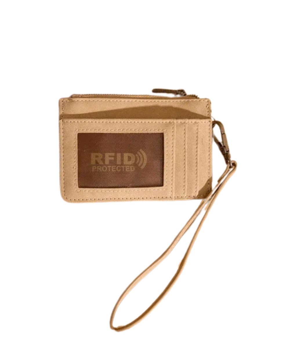 Back view of the women's tan faux leather wallet featuring the RFID protection, clear ID window, multiple card slots, and a removable wristlet strap