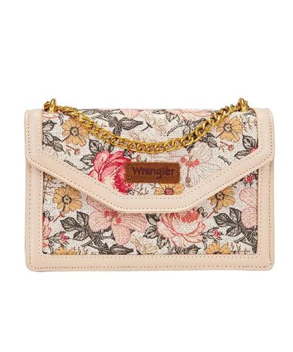 Front view of the women's tan floral Wrangler purse featuring the leather logo patch on the flap, floral printed canvas, and the two-tone gold chain crossbody strap