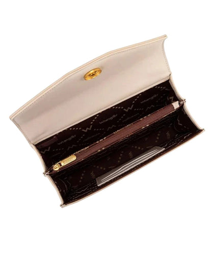 Interior view of the women's tan purse featuring the magnetic flap closure, 2 card slots inside, and a single compartment divided by a medium zippered pocket