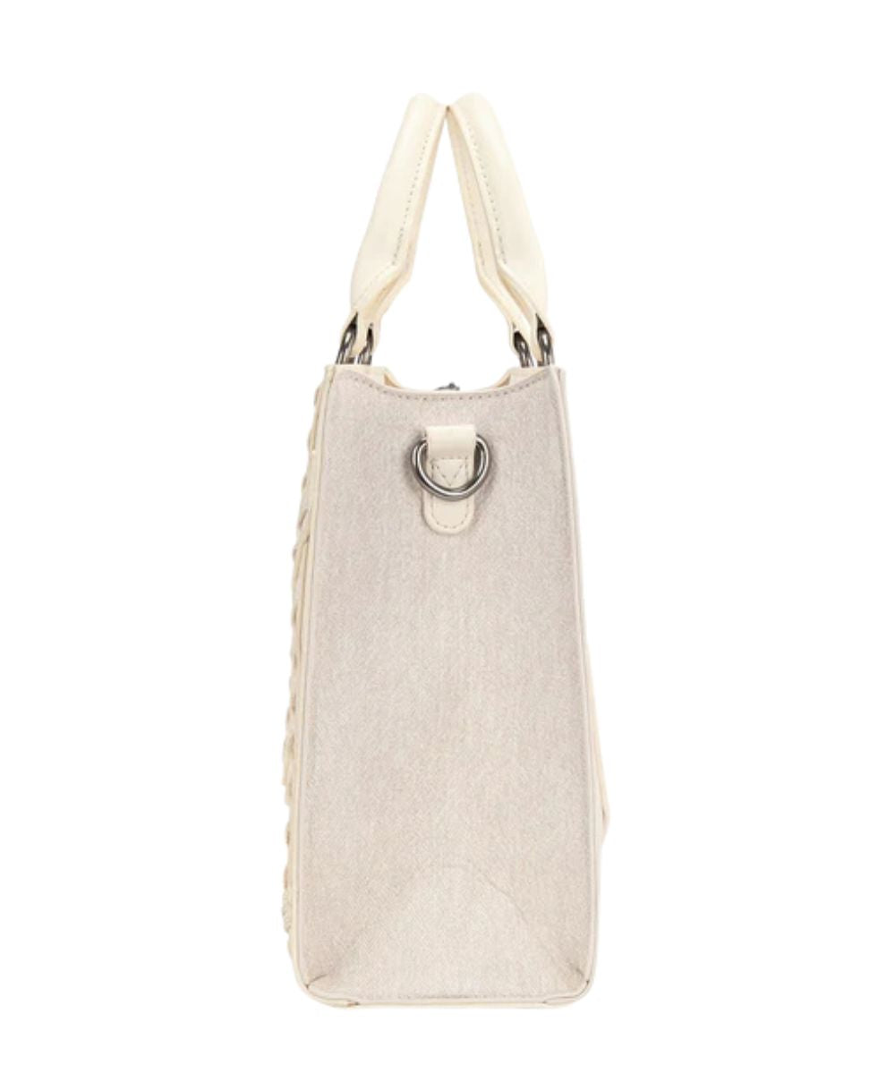 Side view of the women's tan denim tote/crossbody bag featuring a removable/adjustable crossbody strap and top carry handles