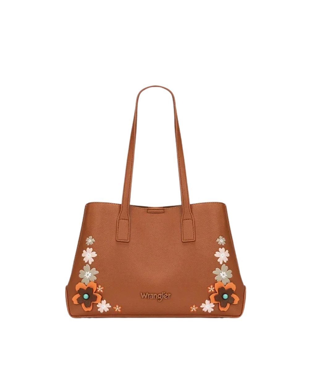 A brown leather tote bag by Wrangler, featuring embroidered floral patterns in orange, white, and light green on the lower corners, with the Wrangler logo printed in gold on the front.