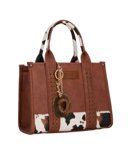 western purse charm on brown purse with a white background