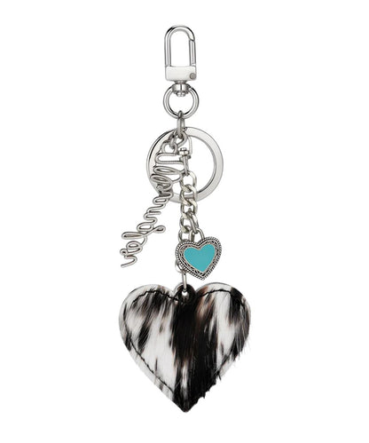 Side view of the women's black hair-on-hide leather heart bag charm