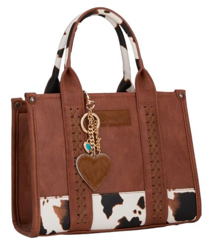 Model view featuring the brown heart bag charm modeled on a bag, bag not included