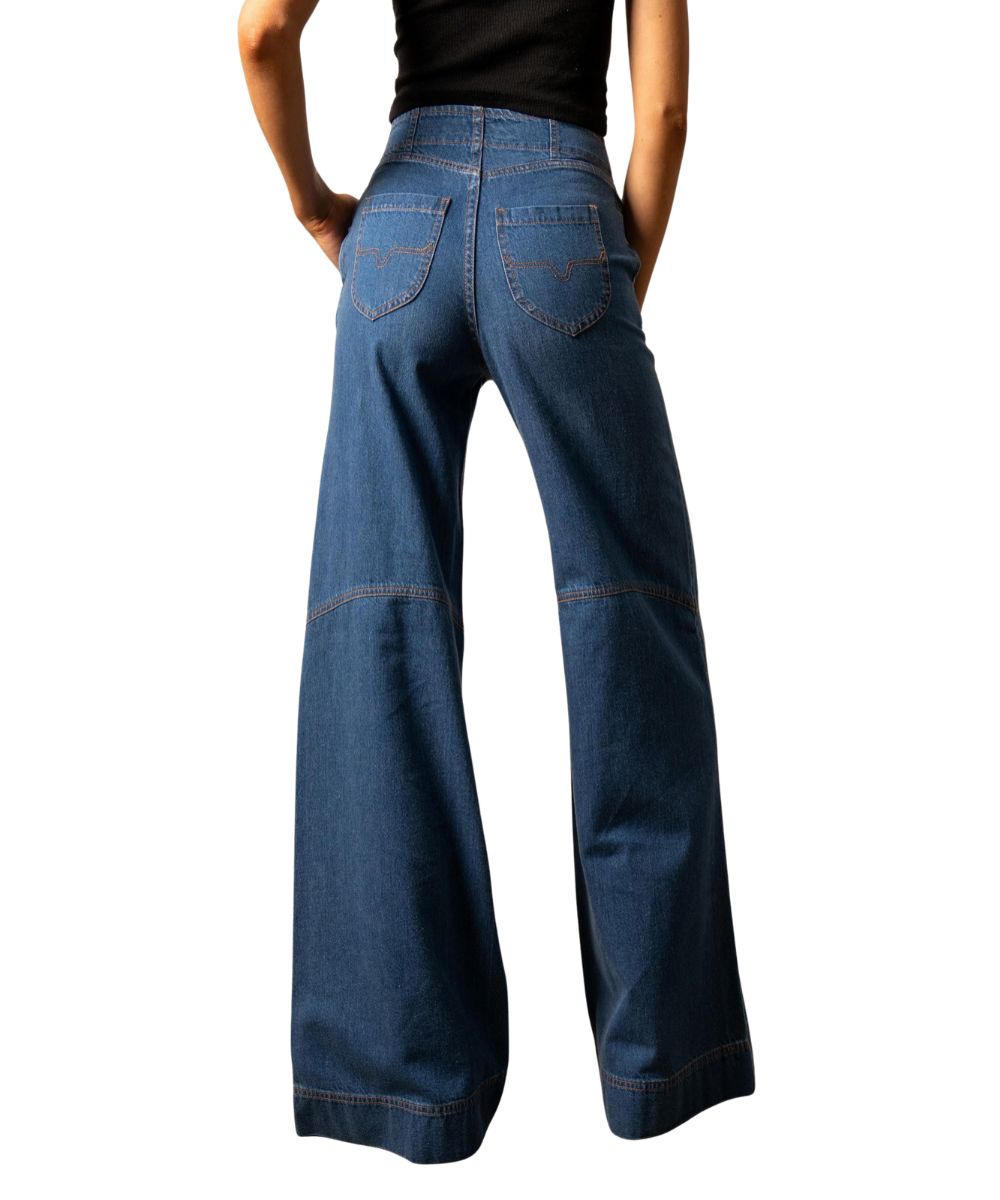 Back view of the women's high rise Kimes Jean featuring the longhorn logo embroidered back pockets, accent stitching at the knee, wide leg, trouser hem, and a left side zipper entry