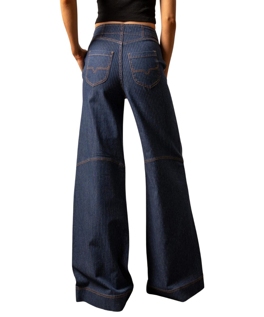 Back view of the women's dark wash Kimes Jean featuring the longhorn logo embroidered back pockets, high rise, seam accent stitching at the knee, wide leg, trouser hem, and a left side zipper entry 