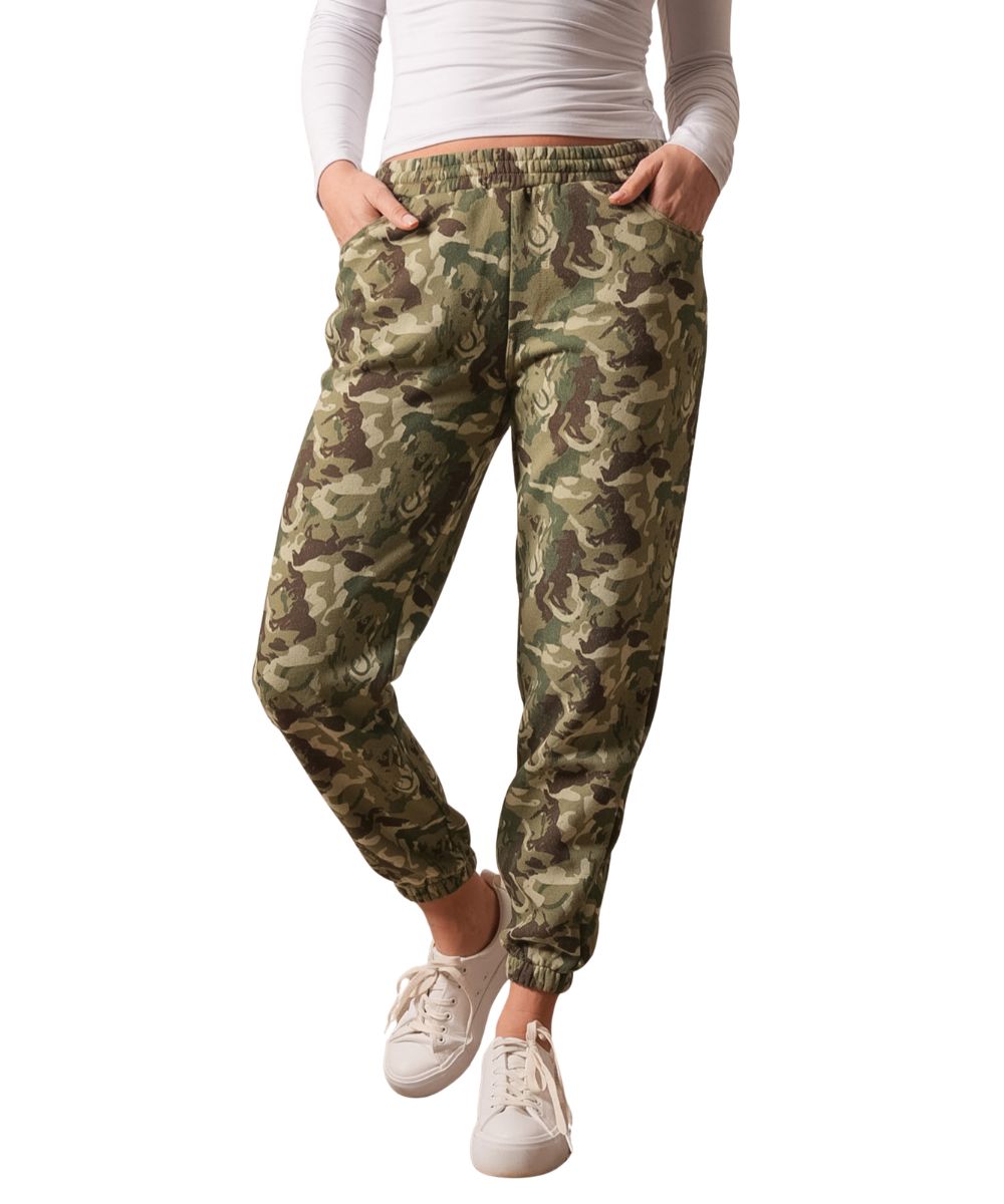 Front view of the women's camouflage Kimes Ranch Page Pants featuring the elastic waistband, jogger-style, cozy fabric, hand pockets, and elastic ankle cuffs