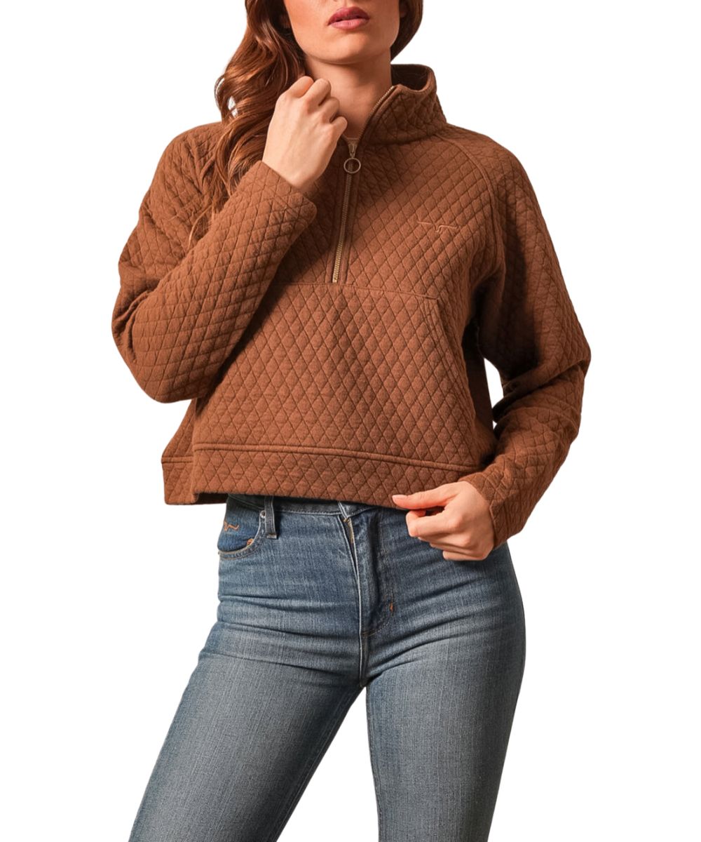 Front view of the women's dark brown Kimes Ranch pullover featuring the quilted fabric, long raglan sleeves, mock neck, 1/4 zip closure, longhorn logo embroidery at the left chest, kangaroo pocket, and a modern cropped silhouette