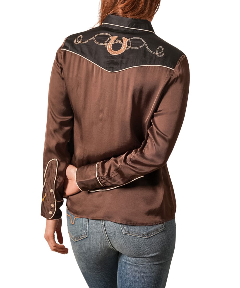 Back view of the women's black pearl snap shirt featuring the color blocked yoke with horseshoe embroidery