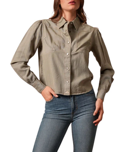 Front view of the women's moss green Kimes Ranch long sleeve snap shirt featuring the solid print, curved western yokes, white diamond-shaped pearl snaps, corded arrowhead mock chest pockets, and cropped length
