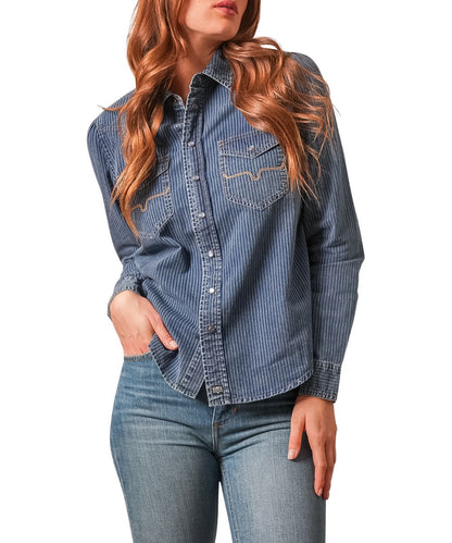 Front view of the women's indigo stripe Kimes Ranch long sleeve snap shirt featuring the pearl snaps, single point snap flap chest pockets, and the vertical striped print