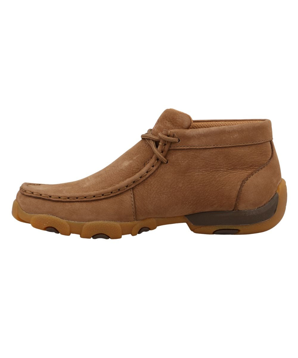 Instep view of the kid's chukka driving moc featuring a plain camel brown leather.