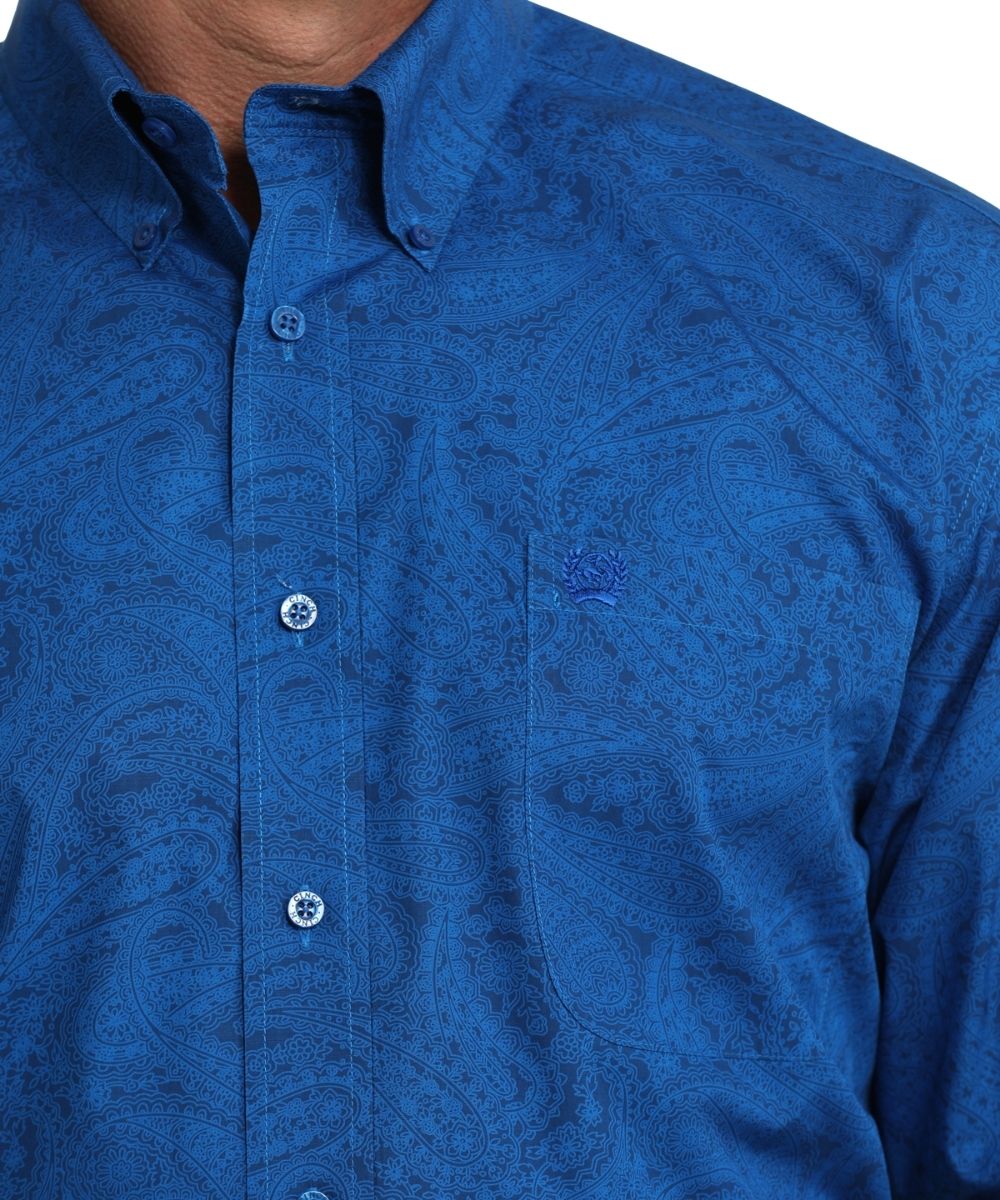 Close up view of single chest pocket and button down collar of cinch royal blue paisley print button down shirt
